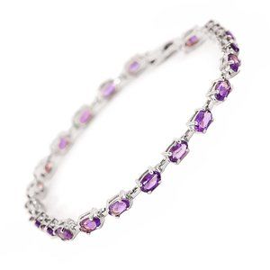 14K. SOLID GOLD TENNIS BRACELET WITH AMETHYST